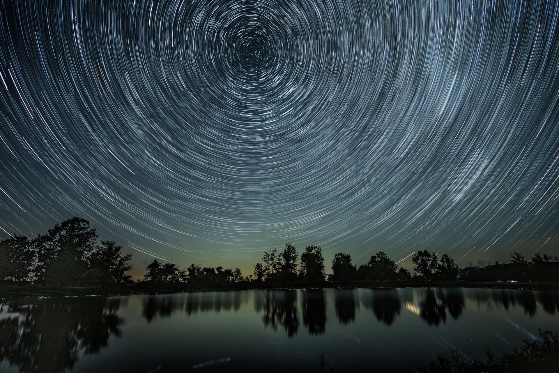 long exposure of stars in sky creating a circle