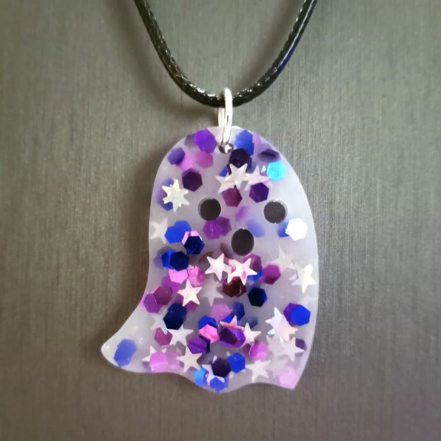 acrylic pendant with embedded stars and hexagons